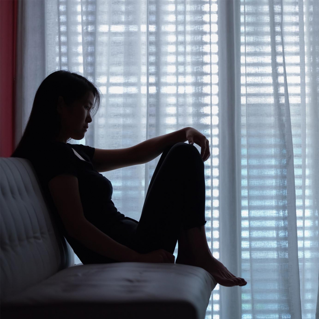 sad woman seating alone